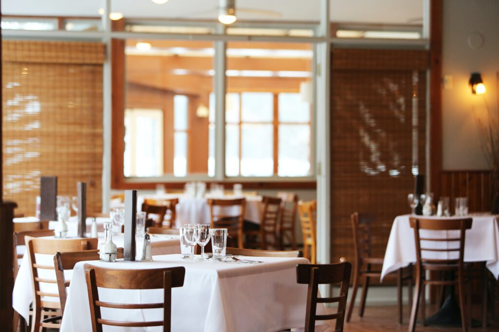 A fresh, clean dining room with tables set, awaiting the day’s first diners