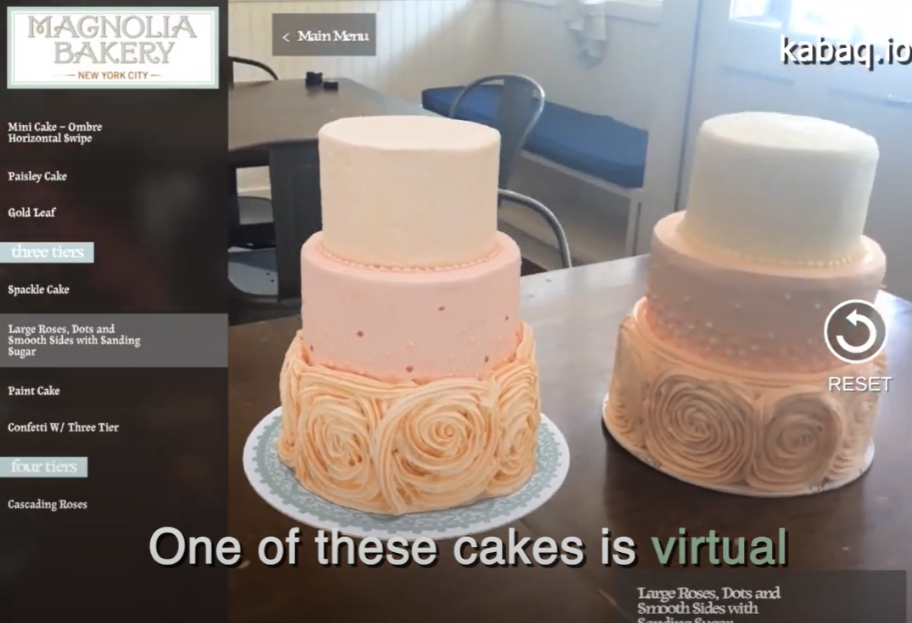 A screenshot showing two cakes, one of which is real, the other of which is presented by augmented reality technology. The Magnolia Bakery in New York successfully uses AR for its catering business.