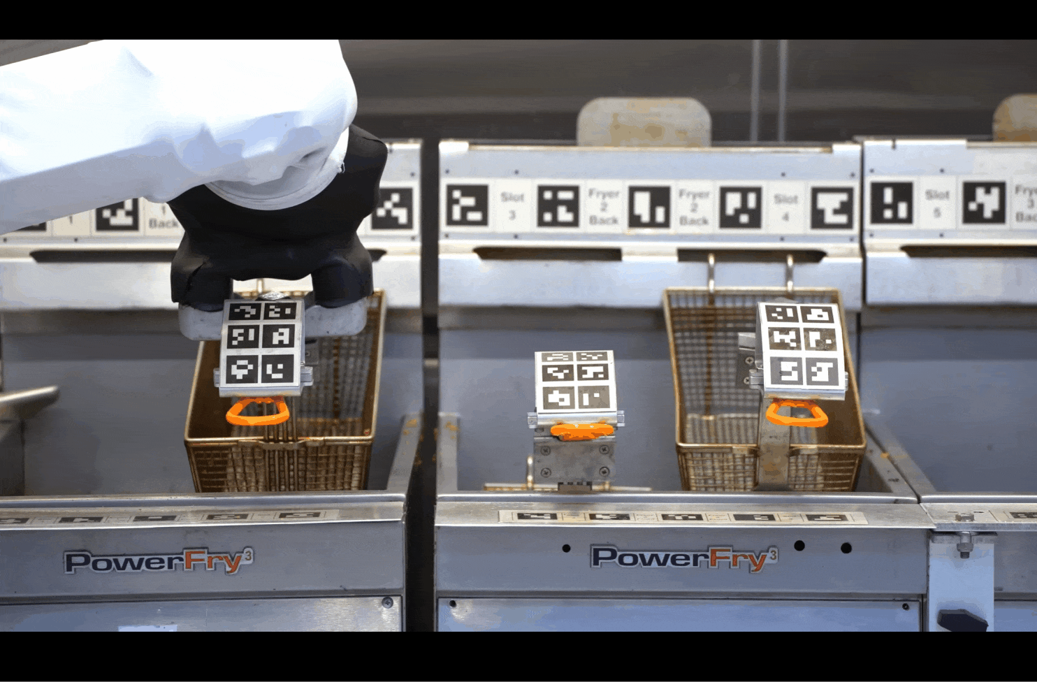 A GIF showing how Flippy, a robotic fry station, works.