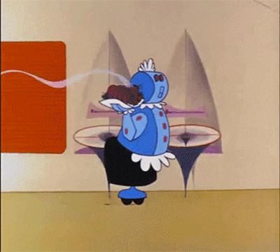 A GIF showing Rosie the Robot, from the cartoon The Jetsons. As Rosie brings in dinner, a contraption drops from the ceiling and instantly sets the table. Rosie then calls, 