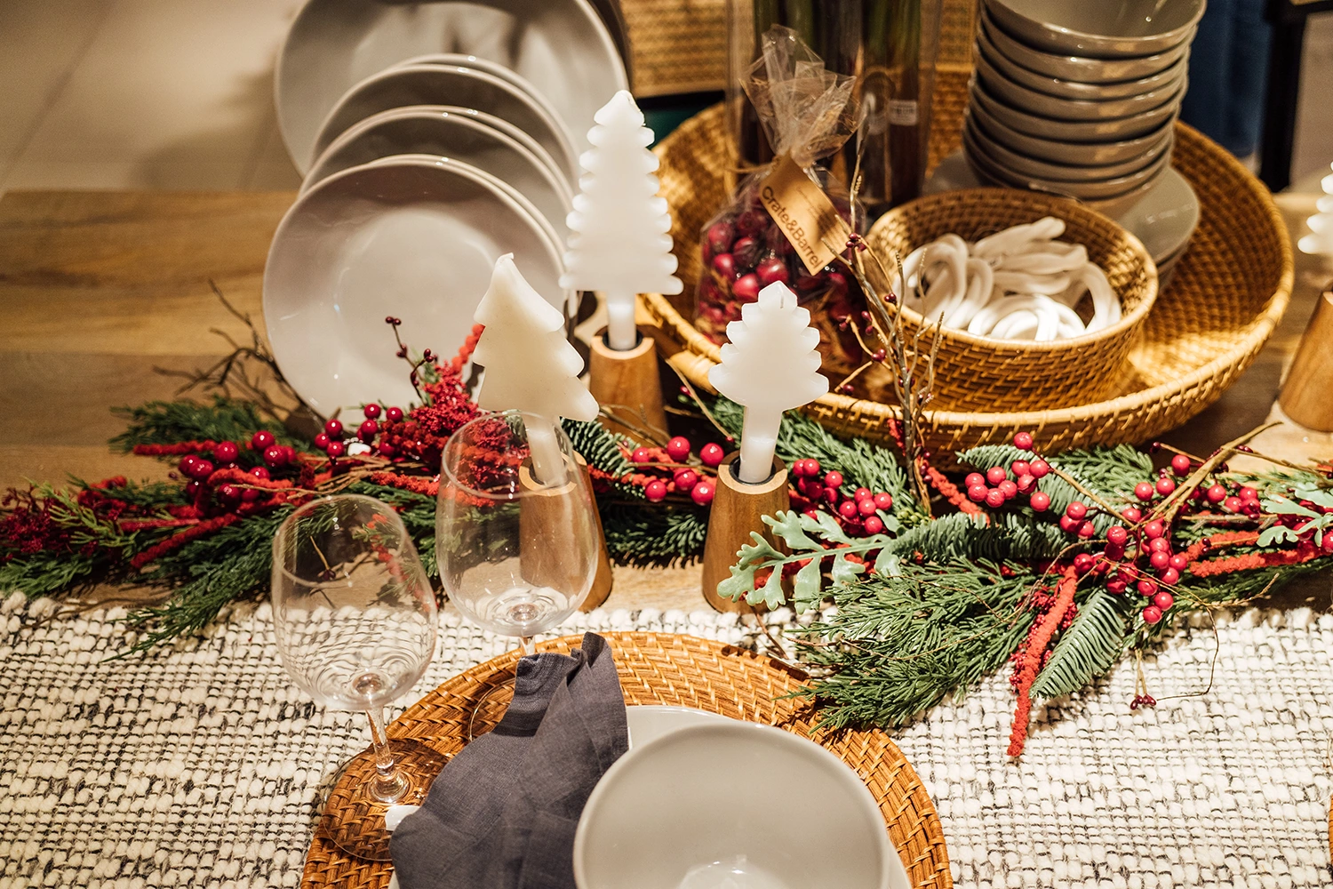A festive table setting with cranberries for the holiday season.